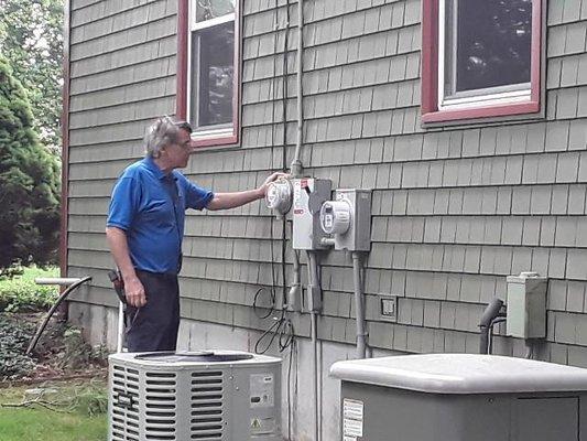 John Checks seal on electric meter