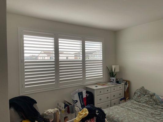 White Classic Wood Shutters in a 3 panel clearview split tilt