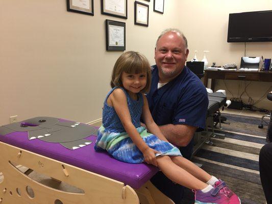 Tayla is the first child to be adjusted on "Ellie", our pediatric adjusting table.