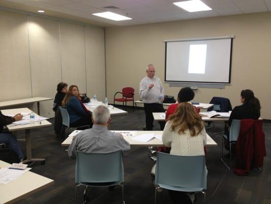 A MAM Employment Services volunteer leads a workshop on resume writing.