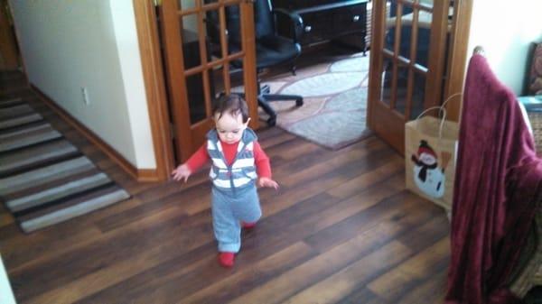 Baby Giovanni loves the new laminate flooring and new carpet from The Carpet Guys.