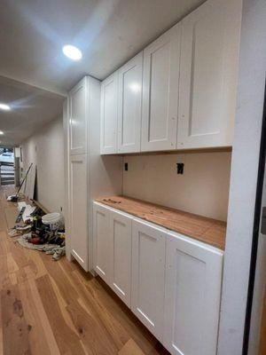 ADU kitchen cabinets before countertops.