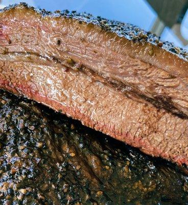 12 hour smoked brisket using Oak Wood, seasoned with salt and black pepper.