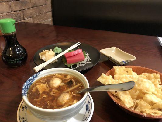 Hot and sour soup with fresh homemade crispy wonton strips and fresh tuna sashimi. Delish