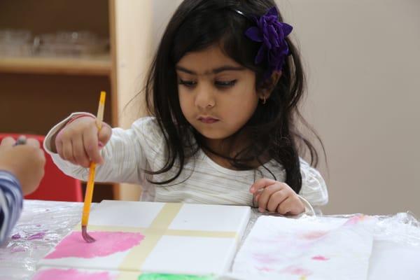 In art class, children learn about famous artists like Andy Warhol, and create their own work in their style.