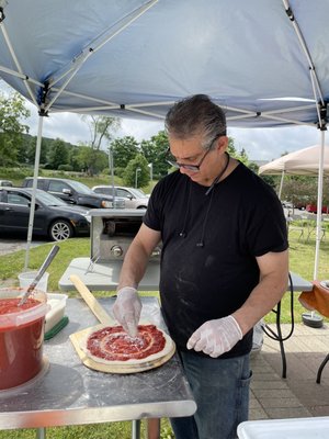 Bart creating fresh baked pizza