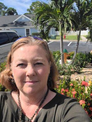 Cathy in front of Palm Cottages in Rockledge