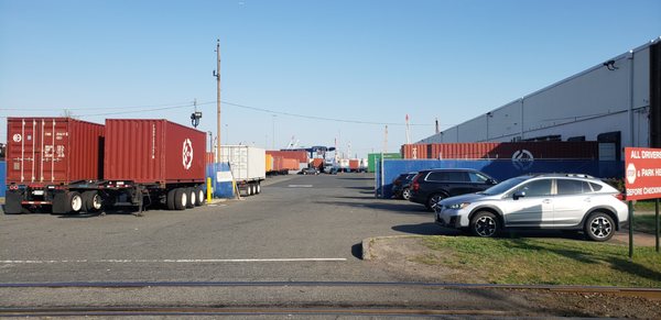 The rational is to (u-turn), then
 back into a tight lot from an active roadway while trucks are also entering & coming off dock doors.