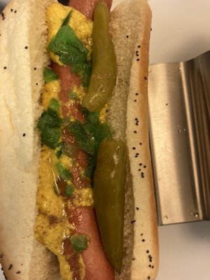 Original Chi town dog mustard relish pepper sport in poppyseed bun.