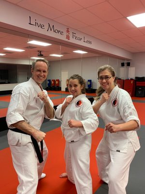 Sensei Michael, my daughter and I after passing our first belt testing.