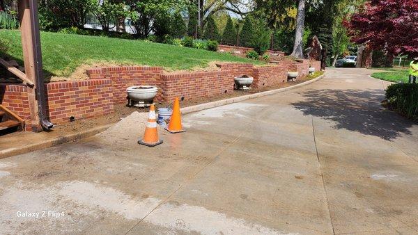 Reinforced brick retaining wall