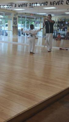 My youngest getting his green tiger belt