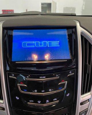 Repair of a Cadillac SRX CUE radio screen. BEFORE