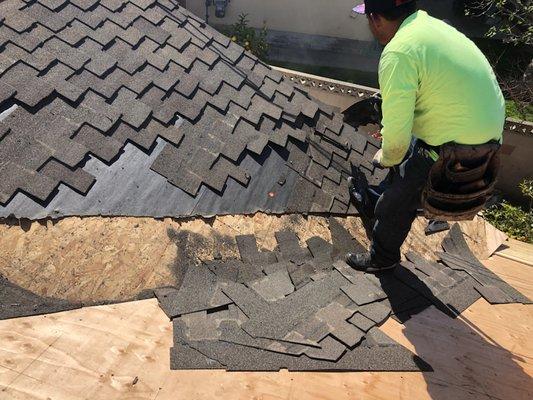 Removing shingles in order to tie into existing roof