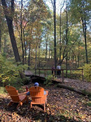 Bright orange Adirondack chair can be found in several trails