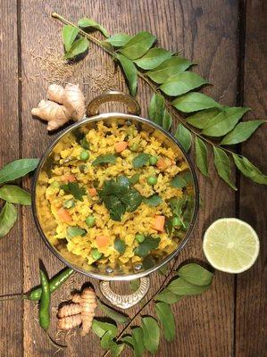 Poha Bowl. An Ayurvedic recipe of flattened rice and vegetables cooked with perfect balance of spices