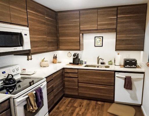 White quartz on walnut cabinets