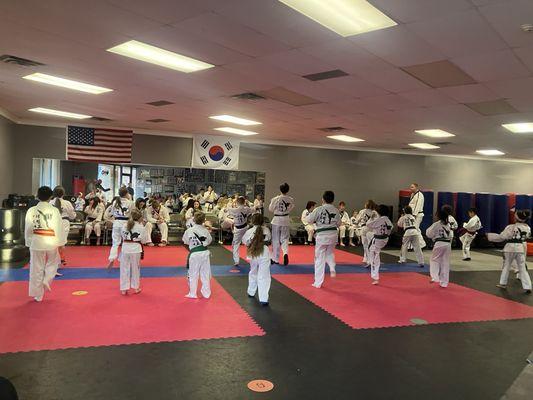 Belt testing every-other month. A super great way to work on stage-fright, too, and a very affirming assessment environment.