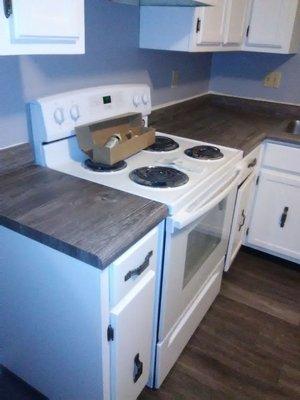 This kitchen was restored with new countertops, flooring and a fresh coat of paint.