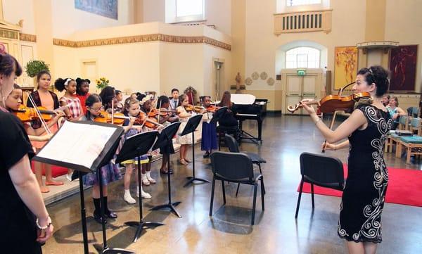 Our students playing with students of DEA Music Academy in London at St. John's Church in Waterloo