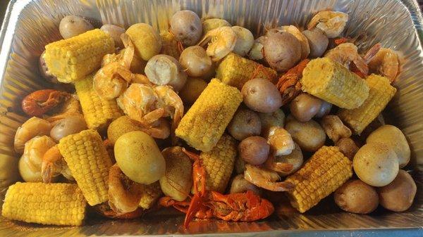 Cajun corn and potatoes with shrimp and crawfish