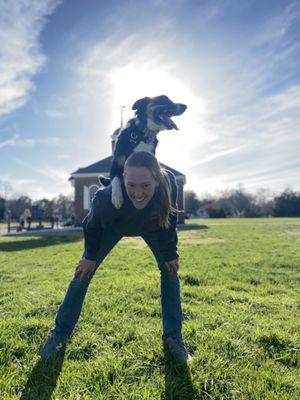 Erika and Dash practicing a "backstall" during disc (frisbee) training at Colonial Williamsburg