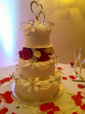 Vanilla cake with strawberry creme and almond cake with vanilla mousse fillings. Fresh flowers from Westwood florist!