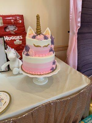 Beautiful 2-tier ombre unicorn cake.  Absolutely delicious buttercream icing and cake flavors.