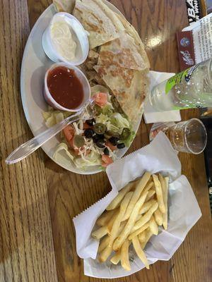 Chicken quesadilla with a side of fries