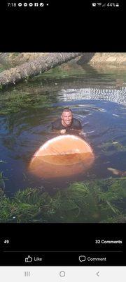 David with the tree stump he had to cut down.