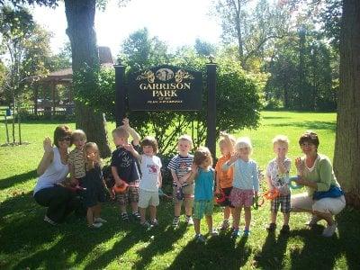 Every day is sunny at Open Door! 3 year old class walks one block to play at Garrison Park .