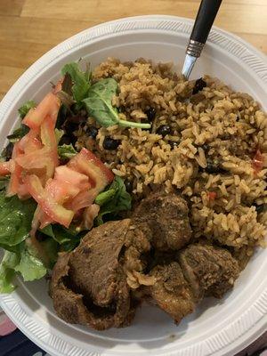 Yellow RICE GREEN PIGEON PEAS STEAK AND A SALAD..