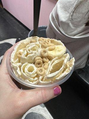 Vanilla ice cream with Cheerios and bananas.