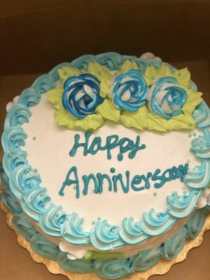 1lb cake with happy anniversary written on top