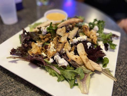 Tavern Salad - spring mix (not just iceberg!!), goat cheese, walnuts, craisins, and chicken with a honey mustard vinaigrette dressing.