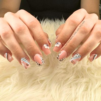 "Get ready for Summer with adorable nail designs! Our salon offers a wide range of festive options. Hop on in and get your nails ready!