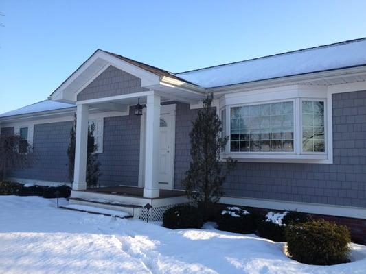 New front porch and cedar impression siding.