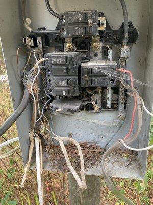 Customer in Segno, Tx. Electrical Panel before replacing with new panel and rewiring