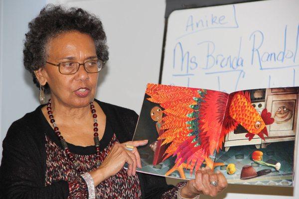 Ms. Randolph discussing children's Africana books.