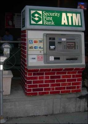 This ATM is located in the  in Lincoln, NE. We painted it to look like it was made out of brick to blend in to the area.