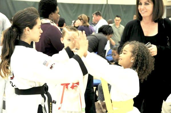 Proud Mother Watching Her Daughter Being Congratulated