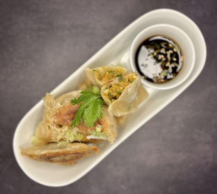 Classic Pork Gyoza.
Juicy ground pork with garlic, ginger, and cabbage, wrapped in delicate dough and pan-fried to perfection.