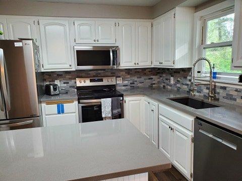 Our kitchen, sink and stove area- NW Granite Quartz Counter