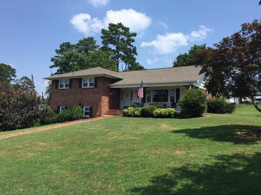 Front of house, drive to carport area