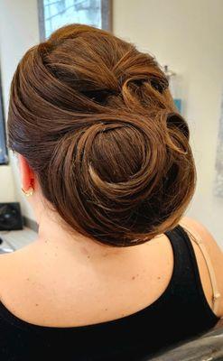 Elegant updo for a Summer wedding.