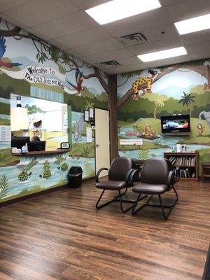 This is the adorable waiting room. They also have books and toys to occupy the kids. There is plenty of seating