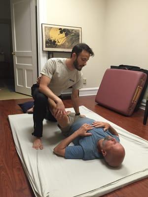 Karden Rabin showcasing Thai hamstring stretch with Bob Sykes