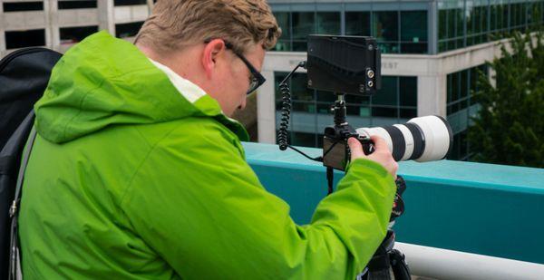 Anthony Cohen filming a travel piece in Seattle Washington.