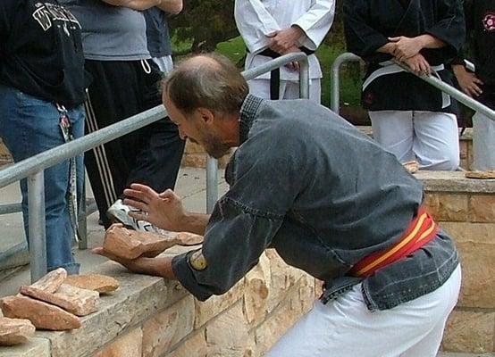 Grandmaster Hausel teaching students the art of breaking rocks at the Arizona Hombu, Chandler, Gilbert, Mesa, Arizona. Adult MA