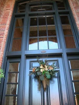 Front door, transom and sidelights in Benjamin-Moores Black Forest Green. Plano